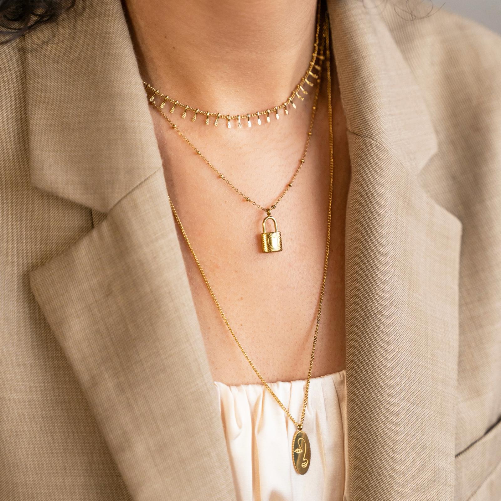 Necklace with pendant female face